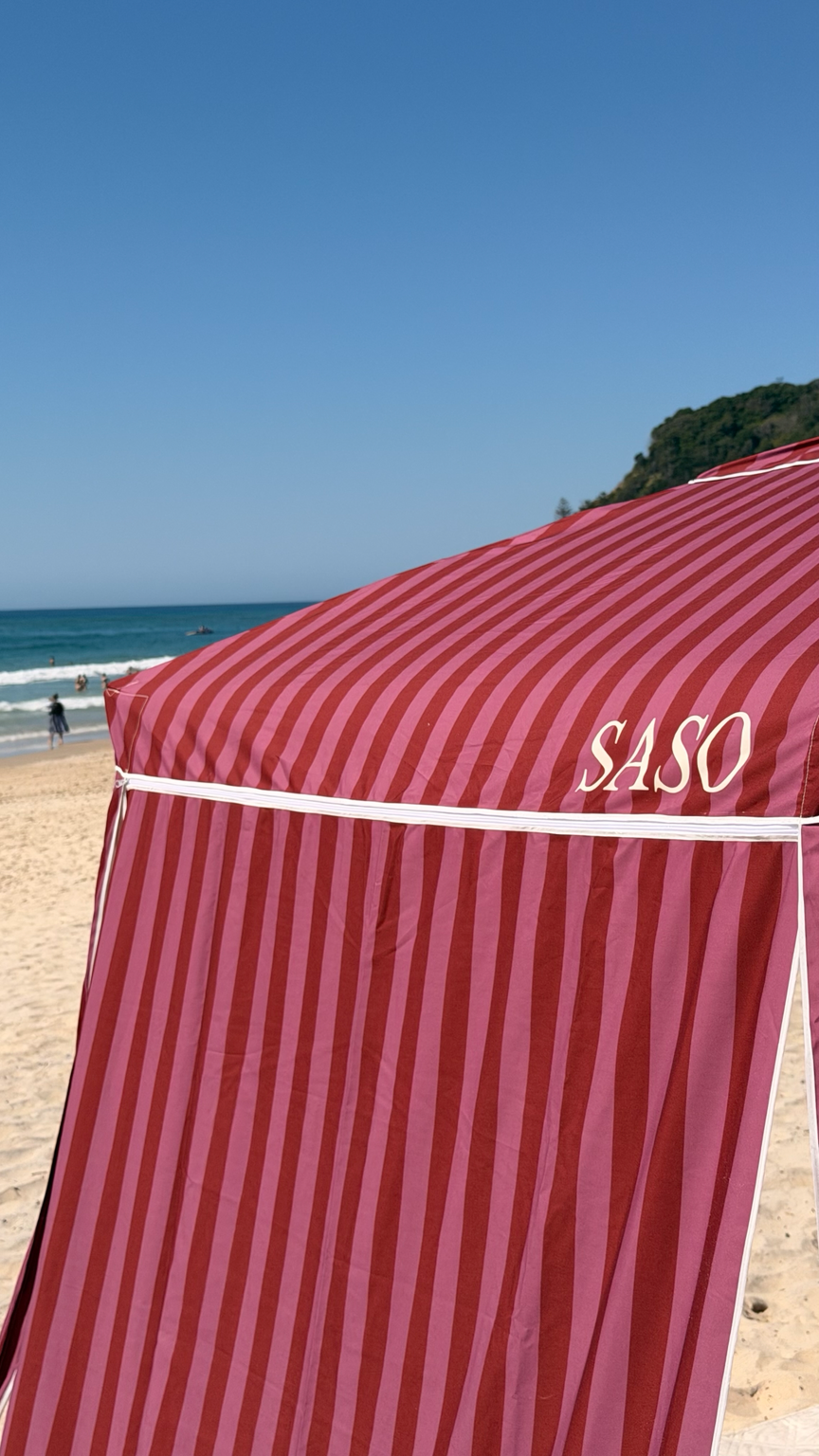 The Miami Cabana in berry and pink stripes at the beach