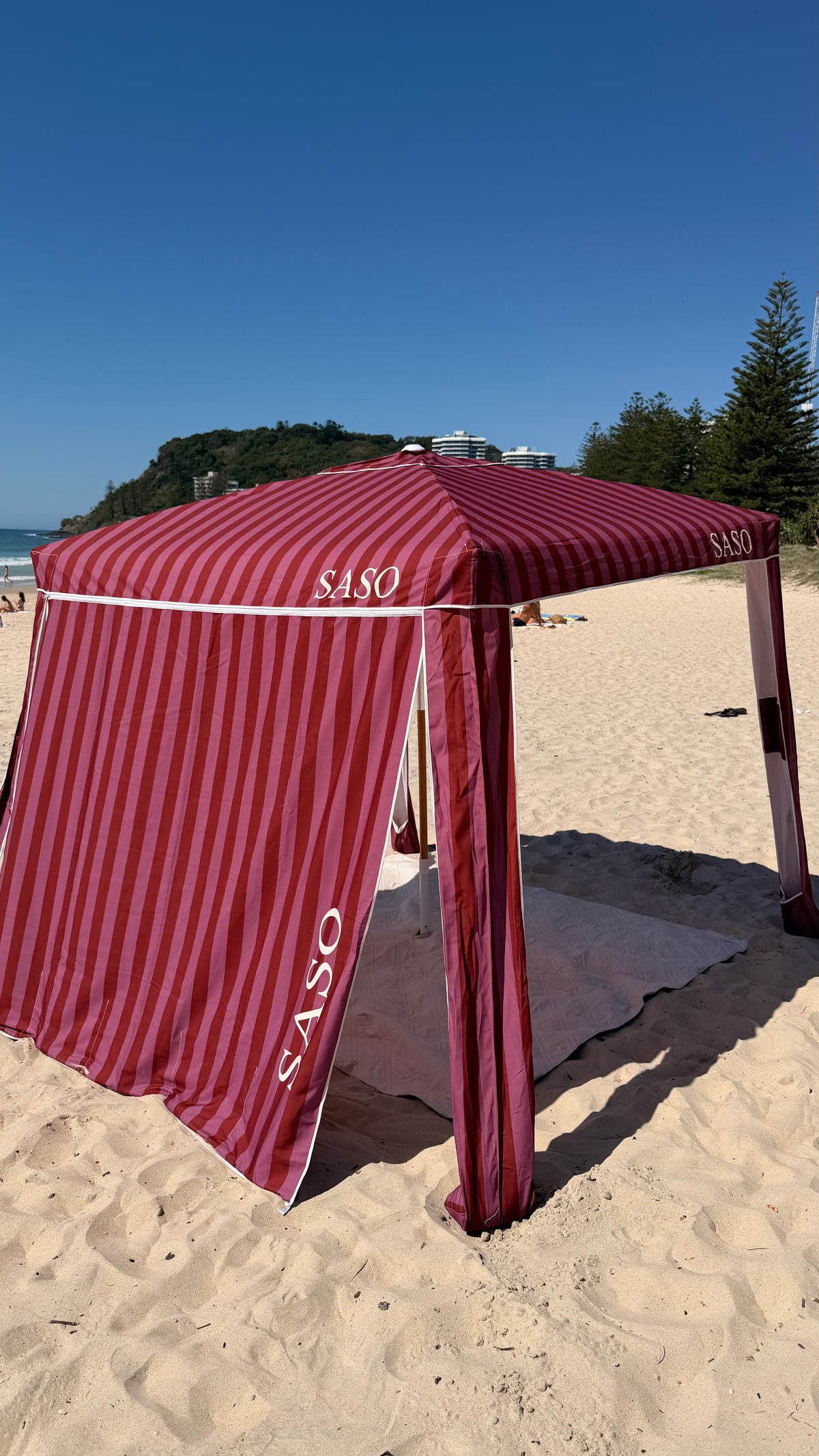 The Miami Cabana in berry and pink stripes at the beach