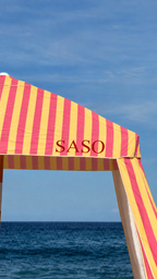 Kirra pink and yellow UPF 50+ beach cabana on an Australian beach