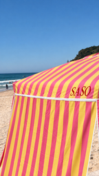 Kirra beach cabana showing rotating canopy and striped shade wall