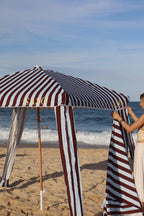 Close-up of the brown-burgundy and pale sky blue striped fabric on The Burleigh Cabana
